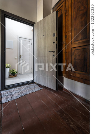 Open Door Entrance with Wooden Floor and Bright Hallway Open Door Entrance with Wooden Floor and Bright Hallway 132292389