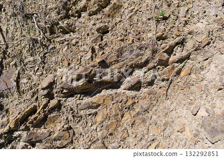 A detailed view of a quarry that is no longer in use. A detailed view of the crumbling remains of stone quarrying. A detailed view of a quarry that is no longer in use. A detailed view of the crumbling remains of stone quarrying. 132292851
