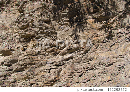 A detailed view of a quarry that is no longer in use. A detailed view of the crumbling remains of stone quarrying. A detailed view of a quarry that is no longer in use. A detailed view of the crumbling remains of stone quarrying. 132292852