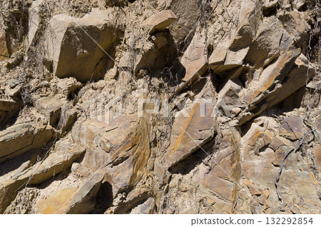 A detailed view of a quarry that is no longer in use. A detailed view of the crumbling remains of stone quarrying. A detailed view of a quarry that is no longer in use. A detailed view of the crumbling remains of stone quarrying. 132292854