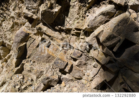 A detailed view of a quarry that is no longer in use. A detailed view of the crumbling remains of stone quarrying. 132292880