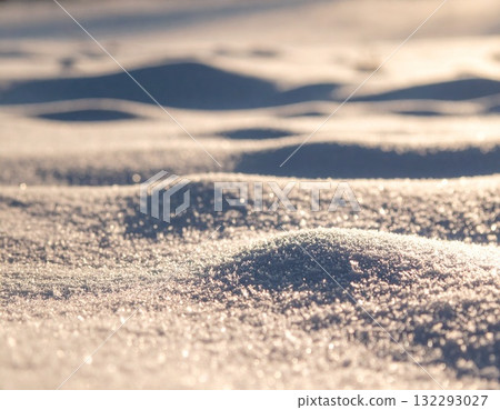 A stylish image of winter, skiing, and slopes. A beautiful landscape background of fresh snow sparkling in the light at night and sparkling lights. 132293027