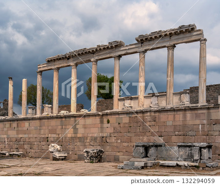 Temple of Trajan ruins with ancient Roman columns, Pergamon Acropolis, Bergama, Izmir, Turkey under cloudy sky Temple of Trajan ruins with ancient Roman columns, Pergamon Acropolis, Bergama, Izmir, Turkey under cloudy sky 132294059