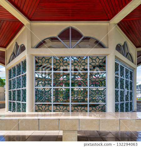 Raja Ayang Mausoleum, Bandar Seri Begawan, Brunei. Architectural details with geometric windows and red wooden roof. Raja Ayang Mausoleum, Bandar Seri Begawan, Brunei. Architectural details with geometric windows and red wooden roof. 132294063