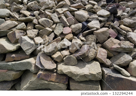 Close-up view of a pile of stones. Material suitable for use in construction. Background for various uses. 132294244