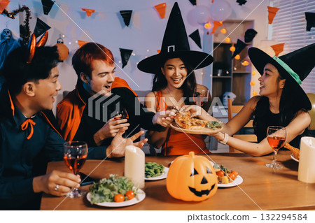 Joyful office Halloween party with coworkers in costumes, celebrating with drinks and laughter, fostering teamwork and festive spirit Joyful office Halloween party with coworkers in costumes, celebrating with drinks and laughter, fostering teamwork and festive spirit 132294584