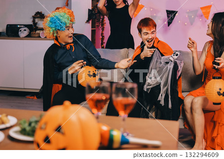 Joyful office Halloween party with coworkers in costumes, celebrating with drinks and laughter, fostering teamwork and festive spirit 132294609