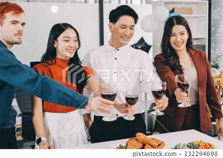 Diversity, dinner and group of people toast celebration together at party. Friends, happy and celebrate with food, wine and friendship for love, support and cheers champagne at business function 132294698
