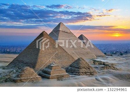 Ancient Egyptian Pyramids Standing Majestically Under Dramatic Sky in the Sahara Desert Landscape Ancient Egyptian Pyramids Standing Majestically Under Dramatic Sky in the Sahara Desert Landscape 132294961
