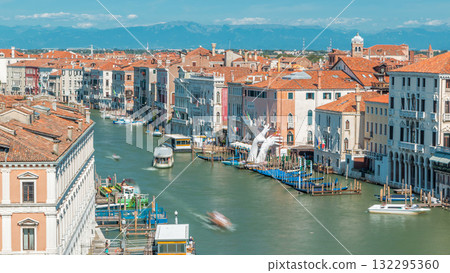 Top view on central busy canal in Venice timelapse, on both sides masterpieces of Venetian architecture Top view on central busy canal in Venice timelapse, on both sides masterpieces of Venetian architecture 132295360