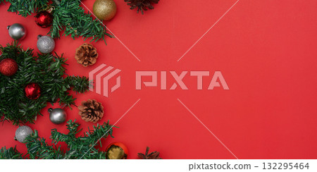 Festive Christmas background with ornaments and pinecones Festive Christmas background with ornaments and pinecones 132295464