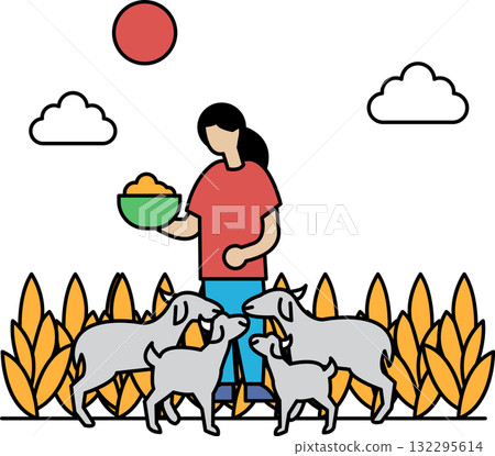 A woman is feeding a group of dogs 132295614