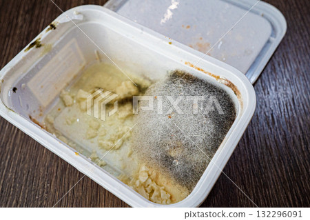 Mold growing on butter in plastic container 132296091