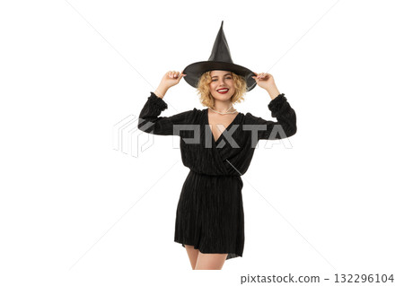 Woman joyfully poses in black dress with witch hat, isolated, PNG Woman joyfully poses in black dress with witch hat, isolated, PNG 132296104