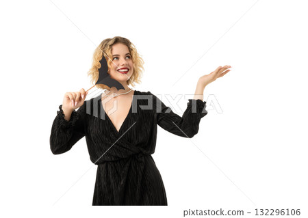 Smiling woman in black with bat mask, isolated on white, PNG 132296106