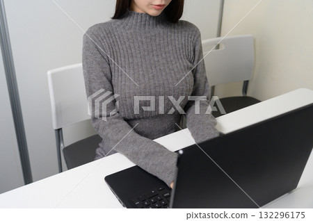 The hand of a Japanese woman who operates a personal computer 132296175