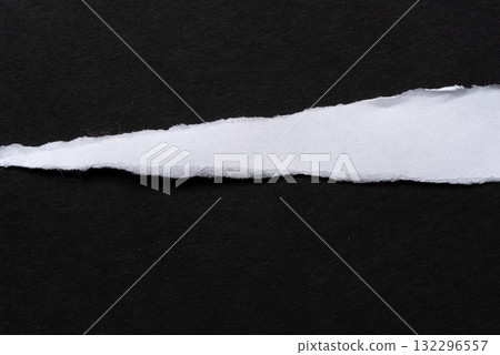 Torn paper on a black background 132296557