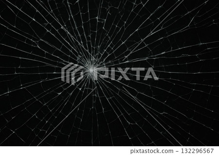 Broken glass with radial cracks on black background for damage concept Broken glass with radial cracks on black background for damage concept 132296567