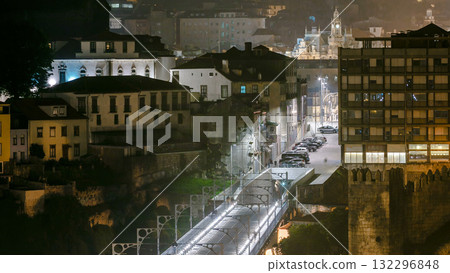 City of Porto by night timelapse in Portugal, the Old Town and Ponte Dom Luiz I arch bridge over Douro river. 132296848