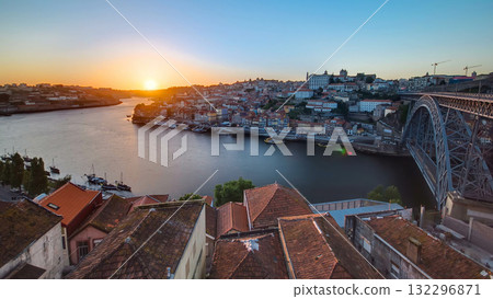 Panorama of old city Porto at river Duoro,with Port transporting boats at sunset timelapse, Oporto, Portugal 132296871