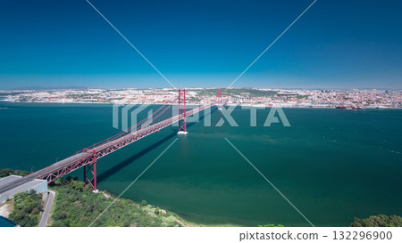 25th of April Suspension Bridge over the Tagus river, connecting Almada and Lisbon in Portugal timelapse 132296900