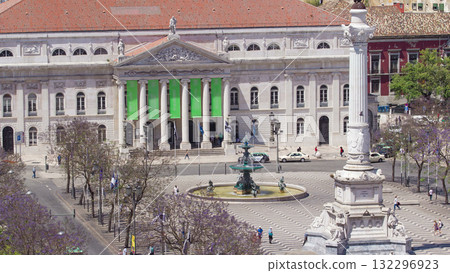 Rossio square in the central Lisbon with a monument of the king Pedro IV from Santa Justa Elevator. Portugal timelapse 132296923