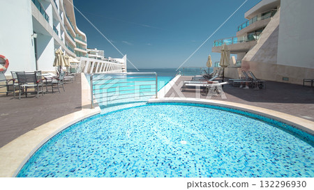 Hotel small swimming pool with sunny reflections timelapse, Sesimbra, Portugal Hotel small swimming pool with sunny reflections timelapse, Sesimbra, Portugal 132296930