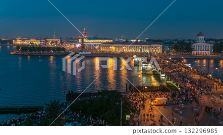 Night view of spit of Vasilyevsky Island and Birzhevoy Bridge with rostral column timelapse, Saint Petersburg, Russia. 132296985