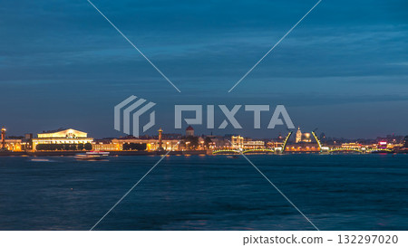 Night view of spit of Vasilyevsky Island and opened Birzhevoy Bridge with rostral column timelapse, Saint Petersburg, Russia. Night view of spit of Vasilyevsky Island and opened Birzhevoy Bridge with rostral column timelapse, Saint Petersburg, Russia. 132297020