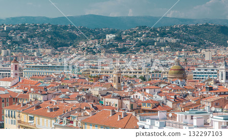 Bright sun lights red roofs of the old city timelapse. Aerial view from Shatto's hill. Nice, France 132297103