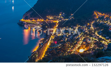 Day to night timelapse view of the Mediterranean coastline of the town of Eze village on the French Riviera 132297126