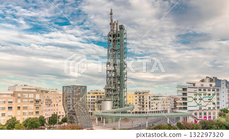 Timelapse hyperlapse of old steel refinery tower with spiral ramp in Lisbon's Park of Nations modern district. Portugal 132297320