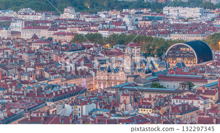Aerial day to night timelapse of Hotel de Ville de Lyon, the historic city hall of Lyon, France. Historic center with red roofs from above. Aerial day to night timelapse of Hotel de Ville de Lyon, the historic city hall of Lyon, France. Historic center with red roofs from above. 132297345