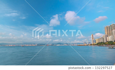 Hong Kong, China skyline panorama day to night from across Victoria Harbor timelapse. 132297527