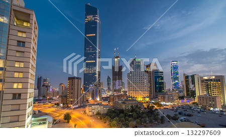 Skyline with Skyscrapers day to night timelapse in Kuwait City downtown illuminated at dusk. Kuwait City, Middle East Skyline with Skyscrapers day to night timelapse in Kuwait City downtown illuminated at dusk. Kuwait City, Middle East 132297609