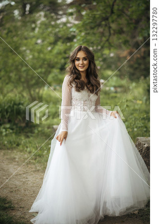 young girl bride in a white dress in a spring forest on a wedding day 132297780
