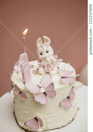 White and pink cake with cute bunny for children's birthday  132297808