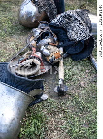 The knight's iron armor lies on the ground The knight's iron armor lies on the ground 132298140