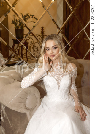close up of beautiful blonde bride in long white dress at hotel close up of beautiful blonde bride in long white dress at hotel 132298204