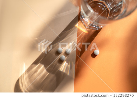 White medical pills lie on the background. White medical pills lie on the background. 132298270