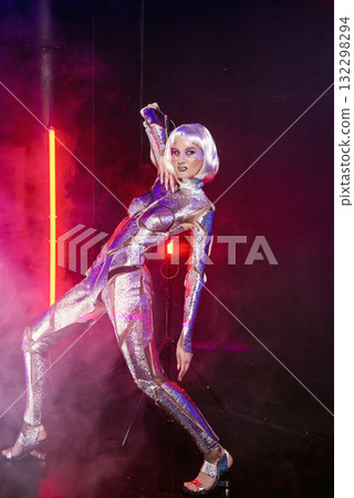 blonde girl as cyber robot. cyber girl in shining silver armor in neon blonde girl as cyber robot. cyber girl in shining silver armor in neon 132298294