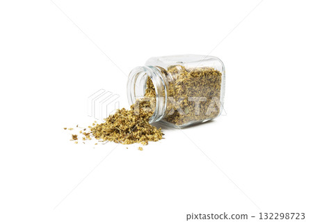 dried flowers of black lilac or black elder in latin sambuci flos falling from glass jar isolated on white background. 132298723