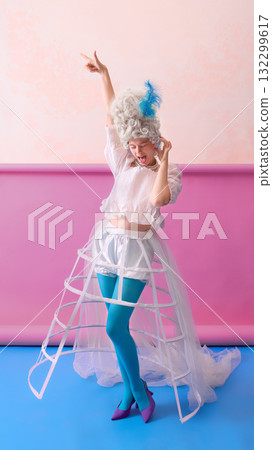 Dancing rococo woman in corset and blue tights expressing joy on colorful background Dancing rococo woman in corset and blue tights expressing joy on colorful background 132299617