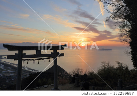The "Sky Torii" gate at Takaya Shrine's main shrine and Ibukijima Island in Takayacho, Kannonji City. The sun sets near Saijo City across the Hiuchi Nada Sea. 132299697