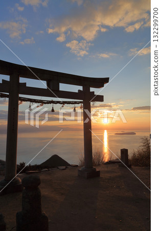 The "Sky Torii" gate at Takaya Shrine's main shrine and Ibukijima Island in Takayacho, Kannonji City. The sun sets near Saijo City across the Hiuchi Nada Sea. The "Sky Torii" gate at Takaya Shrine's main shrine and Ibukijima Island in Takayacho, Kannonji City. The sun sets near Saijo City across the Hiuchi Nada Sea. 132299700