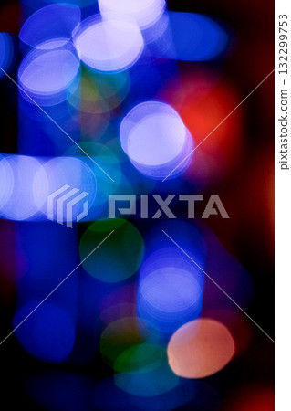 new year lights bokeh background. defocused abstract christmas decorations. blurred garland for festive mood. technological winter holidays. shimmering glow of vertical poster in european colors new year lights bokeh background. defocused abstract christmas decorations. blurred garland for festive mood. technological winter holidays. shimmering glow of vertical poster in european colors 132299753