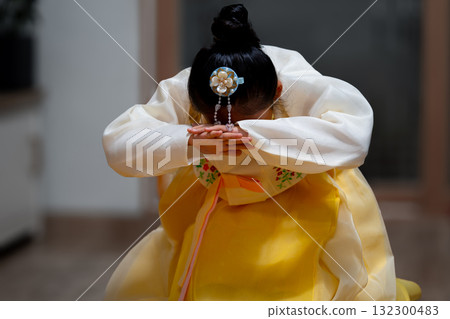 Little girl bow down in korea traditional clothes. Little girl bow down in korea traditional clothes. 132300483