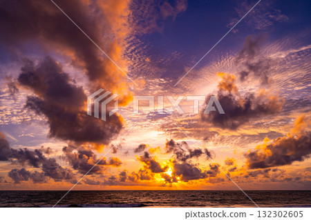 Beautiful sunset or sunrise over the sea with colorful clouds,Amazing clouds and majestic light nature background 132302605