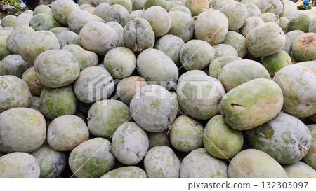 Large piles of ash gourds arranged on the ground in Islamabad market showing freshness local harvest and rural trading life Large piles of ash gourds arranged on the ground in Islamabad market showing freshness local harvest and rural trading life 132303097