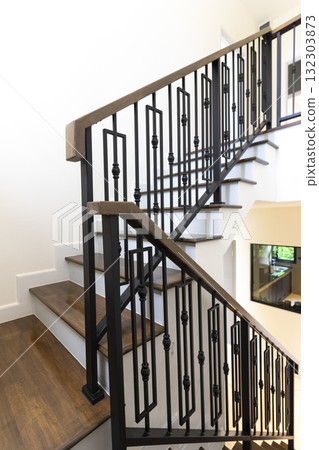 Modern stair case between floors. Stairs with metallic rail in modern building 132303873